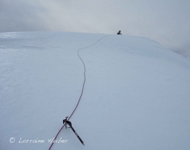 Making snow pitches using snow stakes for anchors